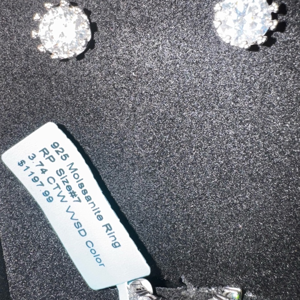3.74 carat moissanite engagement ring and 4 carat moissanite earrings set.